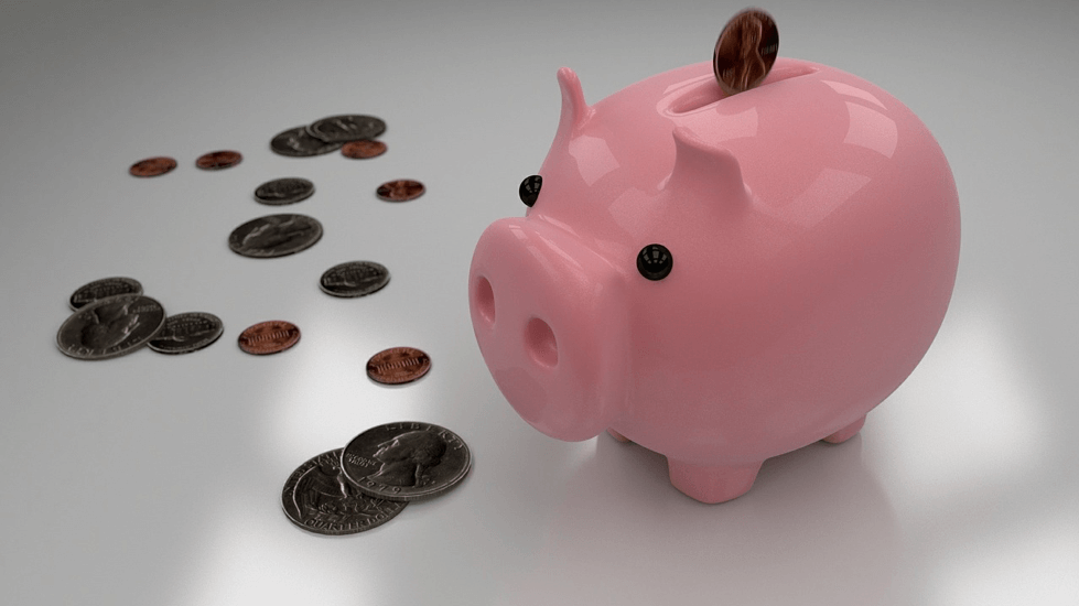 Pink piggybank with change