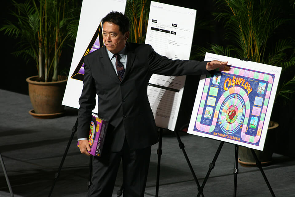 Robert Kiyosaki on stage teaching about CASHFLOW