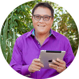 Robert Kiyosaki holding an iPad